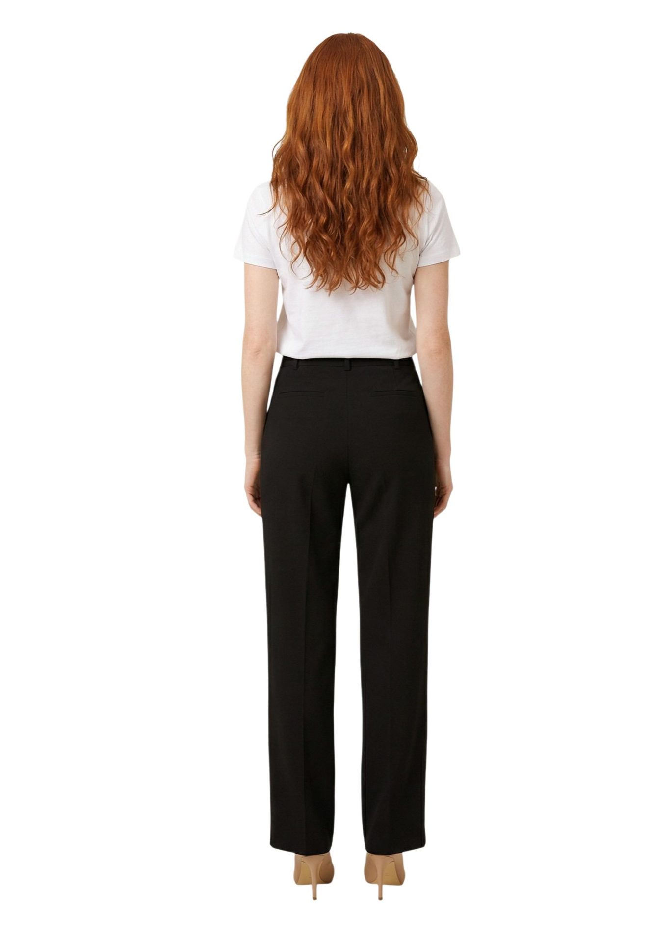 Back view of a woman wearing black straight-leg trousers, a white t-shirt, and beige heels