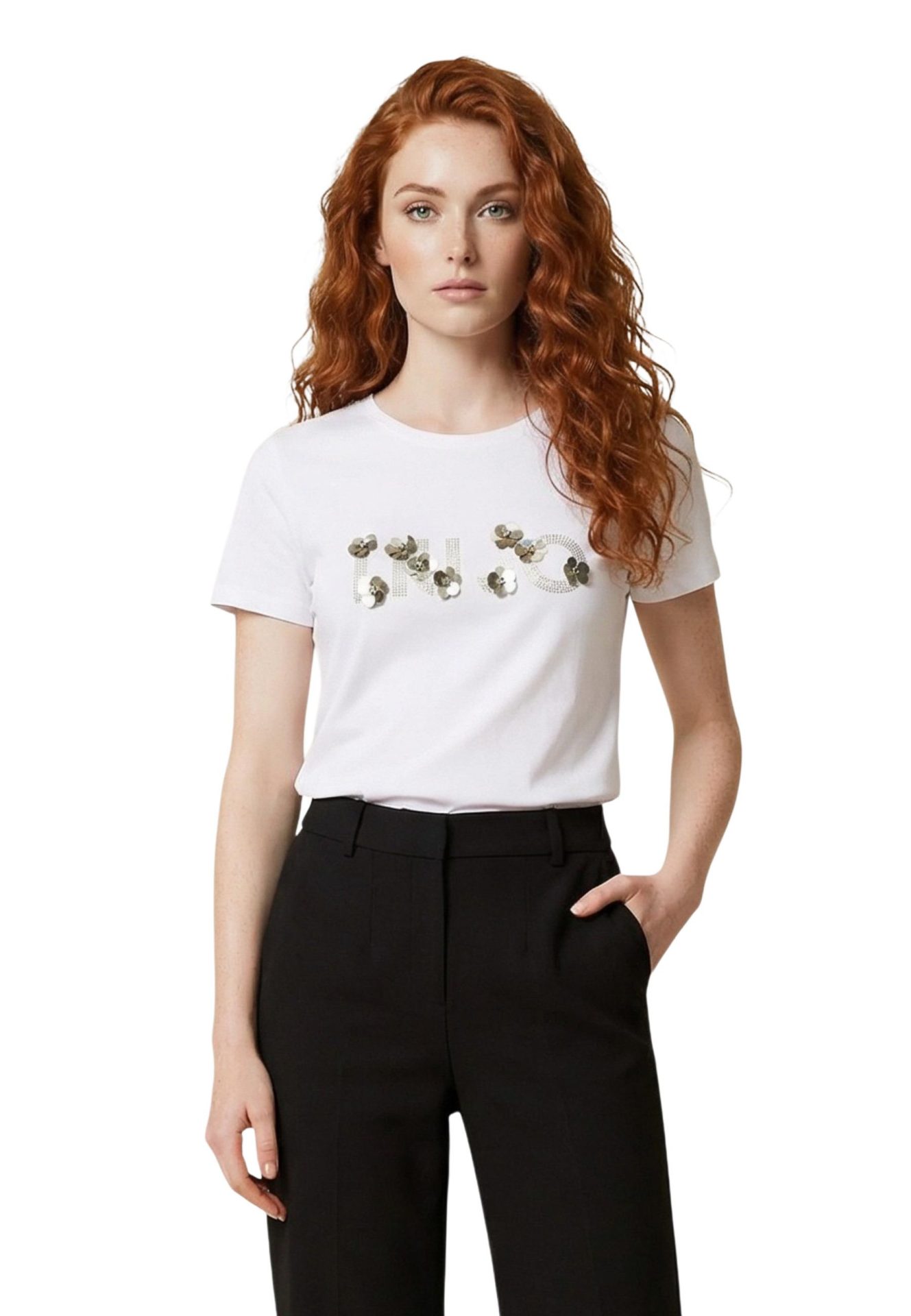Woman wearing a white t-shirt with an embellished Liu Jo logo and black trousers