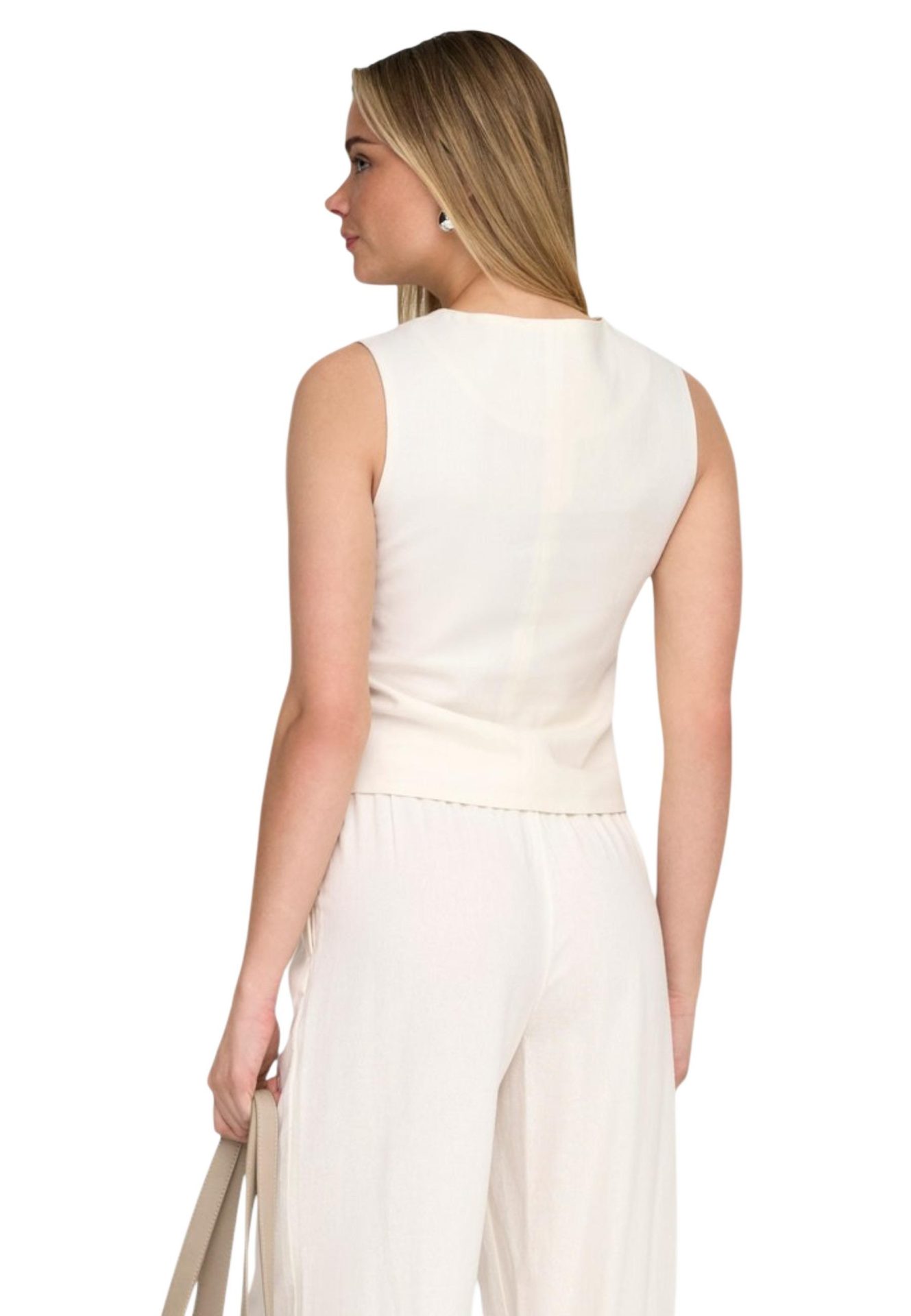 Back view of a woman wearing a sleeveless off-white top and matching pants