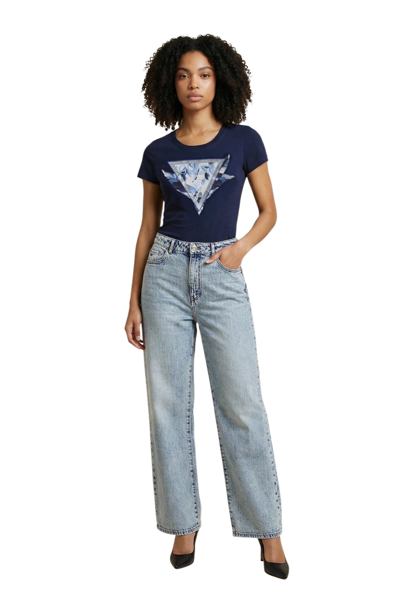 Woman wearing a navy blue graphic t-shirt and light-wash wide-leg jeans