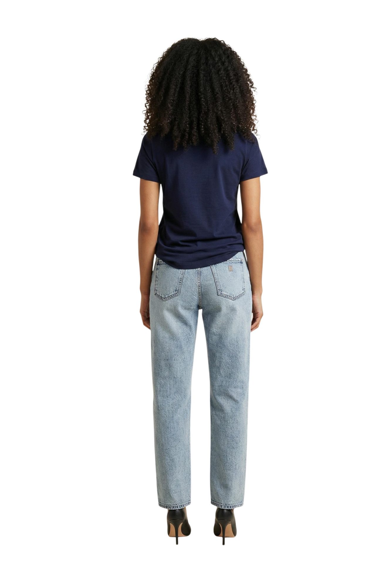 Back view of a model wearing a navy blue t-shirt and light wash straight-leg jeans