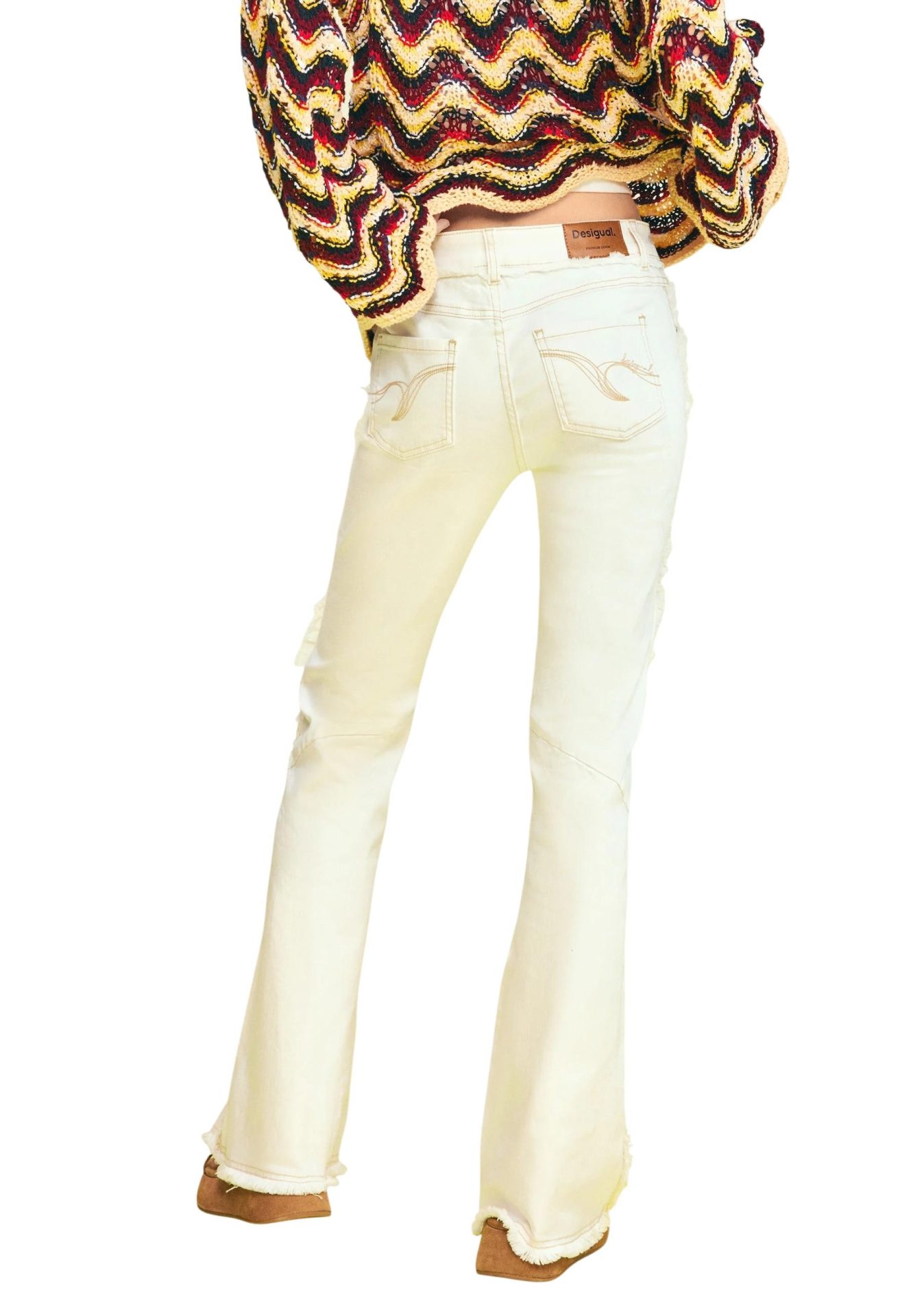Back view of off-white flare jeans with embroidered back pockets, frayed hems, and a Desigual label
