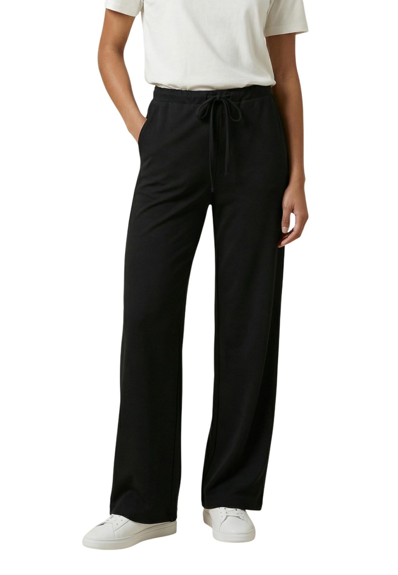 Person wearing black wide-leg drawstring pants with a white t-shirt and white sneakers