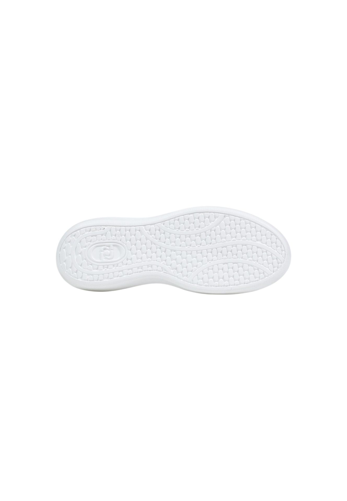 White rubber sole of a shoe showing the textured tread pattern