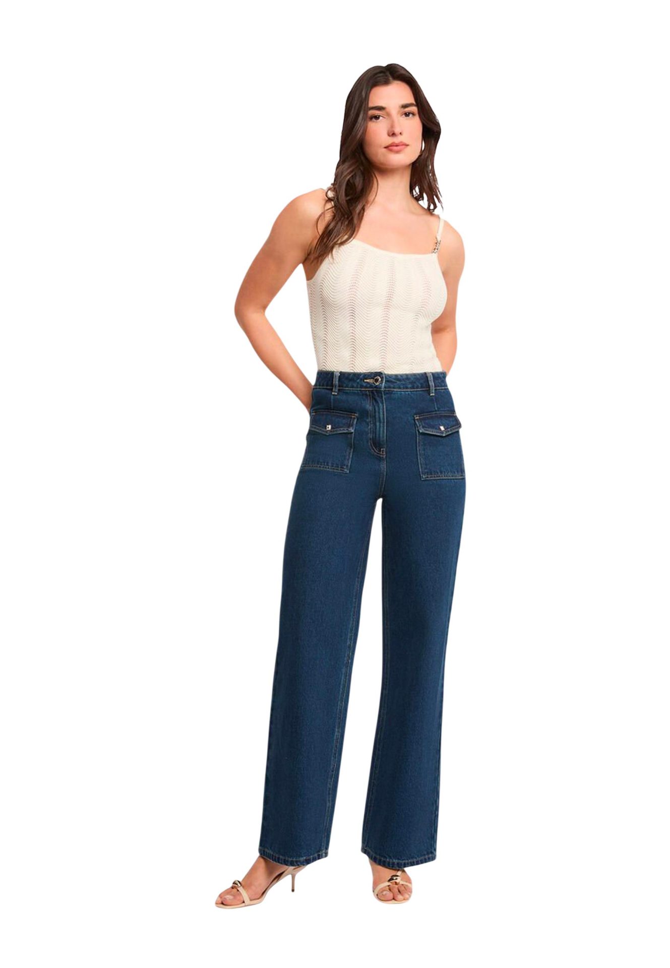 Woman wearing a white knit camisole and high-waisted, wide-leg blue jeans with front flap pockets