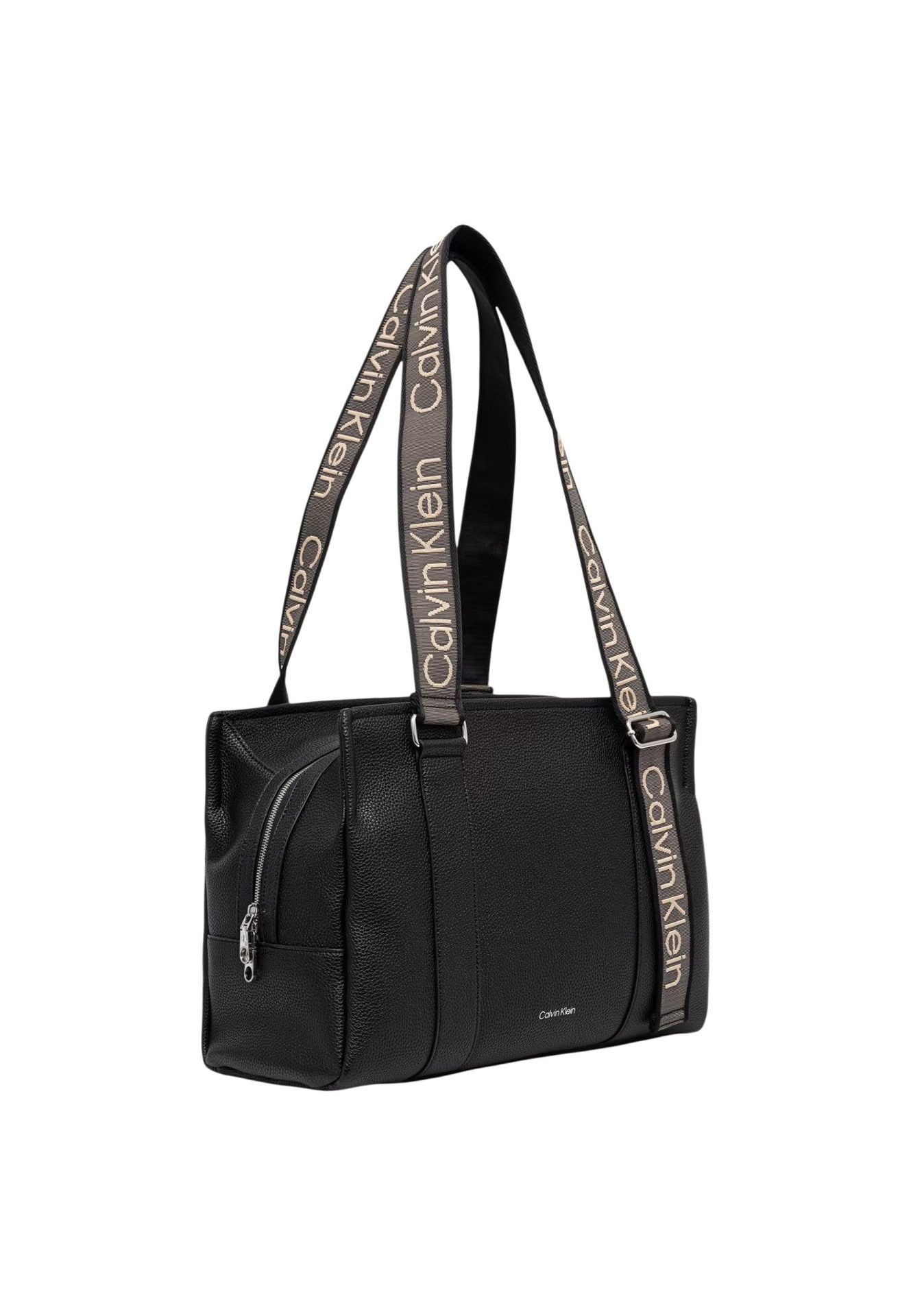 Black pebbled leather handbag with a wide, Calvin Klein branded fabric strap